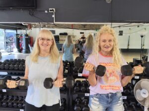 Lyn, Gym Chaplain, with Ellie who was baptised in 2024 after coming as a gym client several years before.